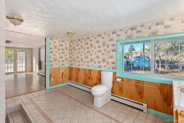 7032 County Road 156c, Salida, CO 81201 - bathroom with a baseboard heating unit, wallpapered walls, and baseboard heating