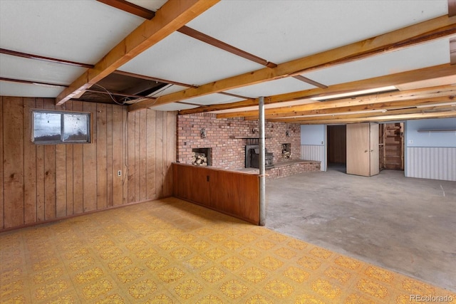 7032 County Road 156c, Salida, CO 81201 - below grade area with wooden walls and a brick fireplace