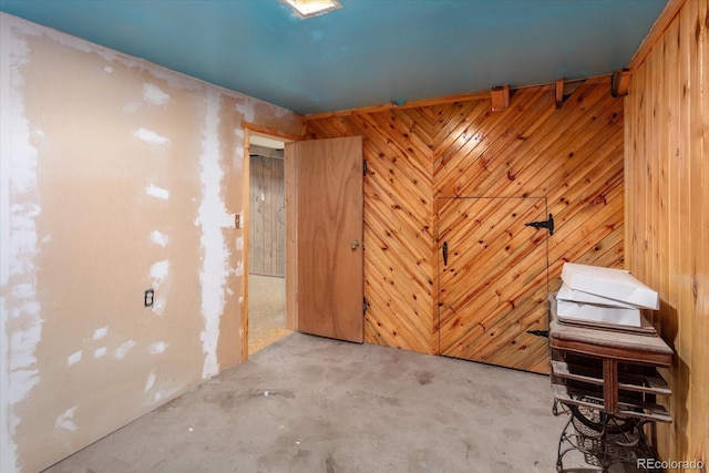 7032 County Road 156c, Salida, CO 81201 - miscellaneous room featuring concrete flooring and wood walls