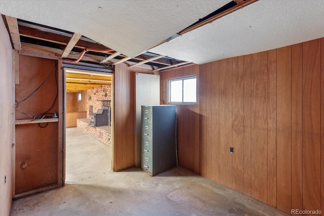 7032 County Road 156c, Salida, CO 81201 - basement featuring a brick fireplace and wood walls