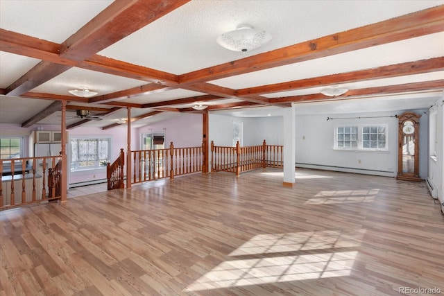 bonus room featuring a textured ceiling, ceiling fan, baseboard heating, and light hardwood / wood-style flooring