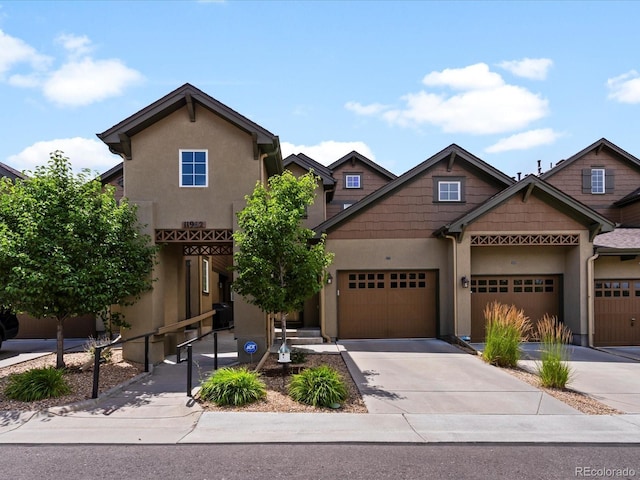 11962 W Long Cir Unit 203, Littleton, CO 80127 - view of front of home with stucco siding and driveway