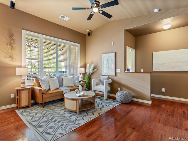 11962 W Long Cir Unit 203, Littleton, CO 80127 - living room featuring a ceiling fan, wood finished floors, and vaulted ceiling