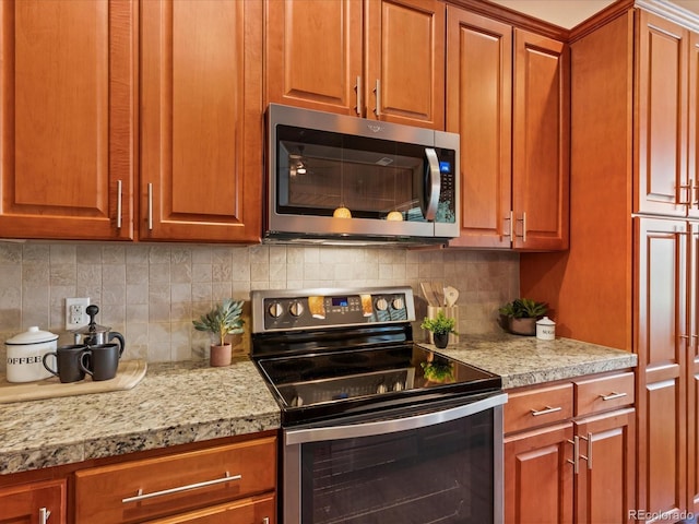 11962 W Long Cir Unit 203, Littleton, CO 80127 - kitchen featuring appliances with stainless steel finishes, light countertops, and backsplash