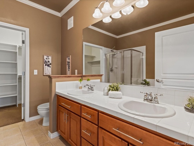 11962 W Long Cir Unit 203, Littleton, CO 80127 - full bathroom with a shower stall, a spacious closet, double vanity, crown molding, and tile patterned flooring