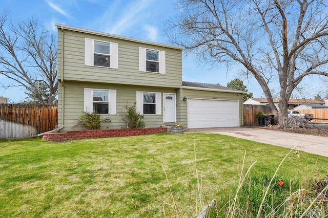 colonial house with concrete driveway, an attached garage, fence, and a front yard