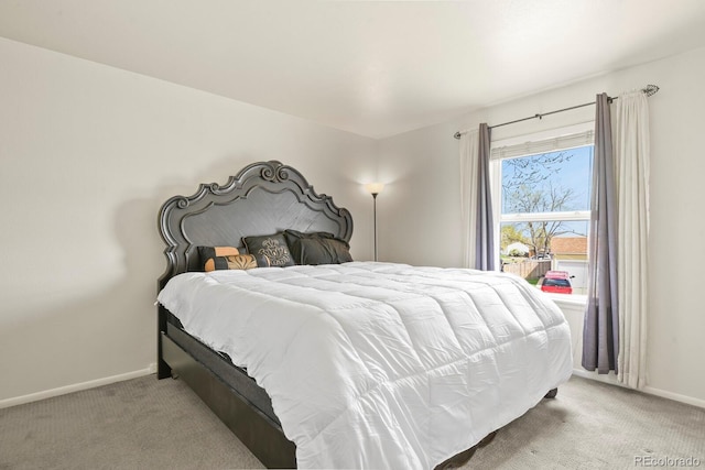 bedroom featuring carpet flooring and baseboards
