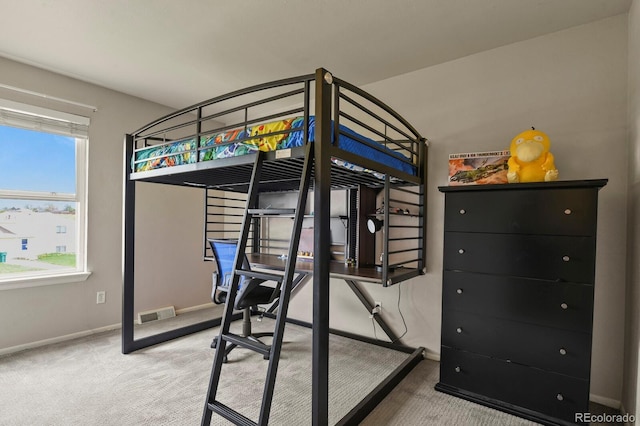 bedroom with baseboards, carpet flooring, and visible vents