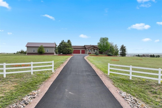 3519 Zane Gray Loop, Parker, CO 80138 - ranch-style home featuring driveway, a garage, and a rural view