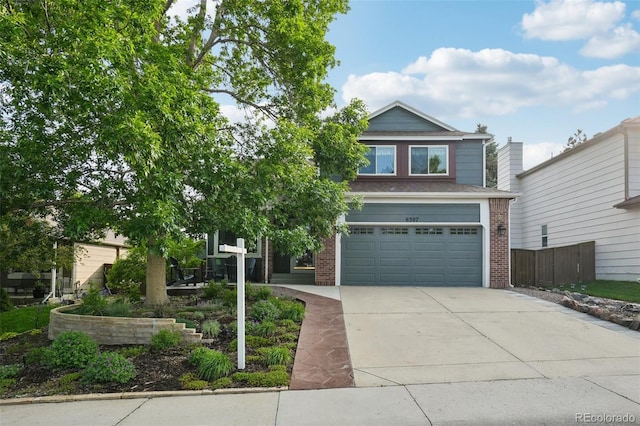 6307 Monterey Pl, Highlands Ranch, CO 80130 - view of front of property with brick siding, concrete driveway, and a garage