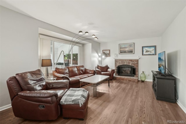 6307 Monterey Pl, Highlands Ranch, CO 80130 - living room with wood finished floors, a fireplace, and baseboards