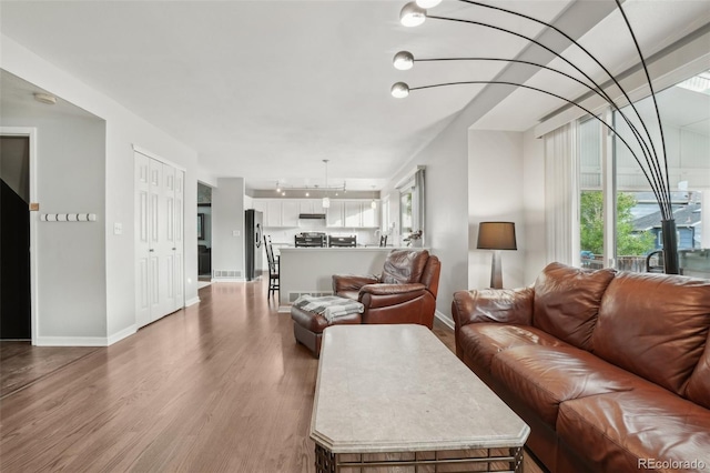 6307 Monterey Pl, Highlands Ranch, CO 80130 - living area with wood finished floors and baseboards