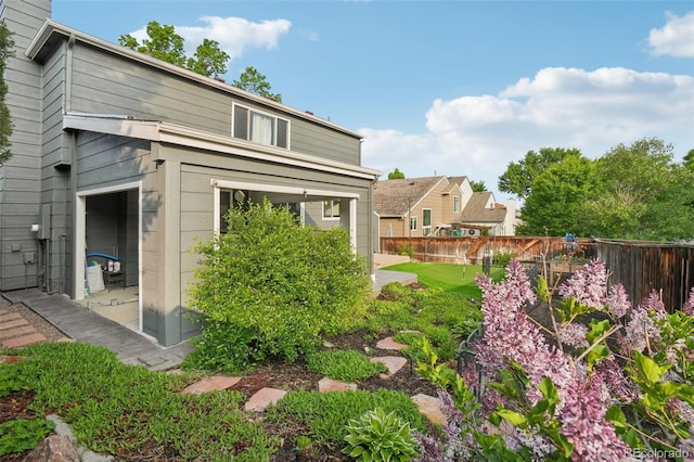 6307 Monterey Pl, Highlands Ranch, CO 80130 - rear view of house with a fenced backyard