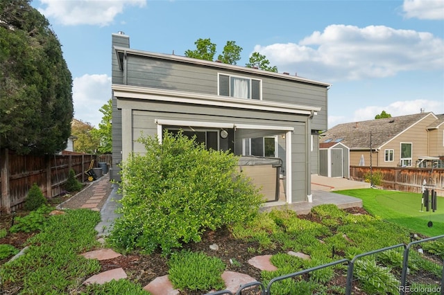 6307 Monterey Pl, Highlands Ranch, CO 80130 - back of property with a chimney