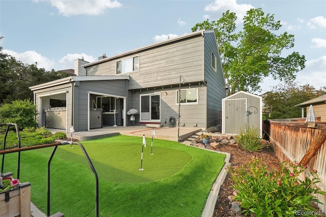 6307 Monterey Pl, Highlands Ranch, CO 80130 - rear view of property featuring a putting green and a patio