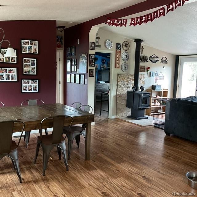 696 Calle De La Nieva, Florissant, CO 80816 - dining area featuring wood finished floors and a wood stove
