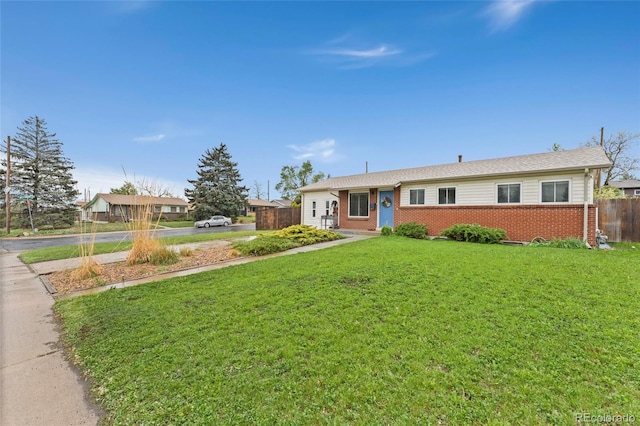 single story home featuring brick siding