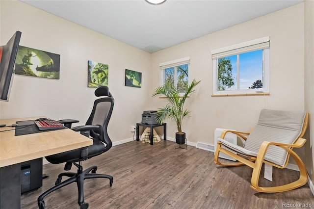 office space featuring wood finished floors and baseboards