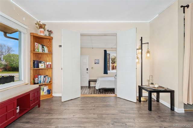 entryway featuring wood finished floors and baseboards