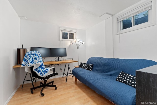 home office featuring wood finished floors and baseboards