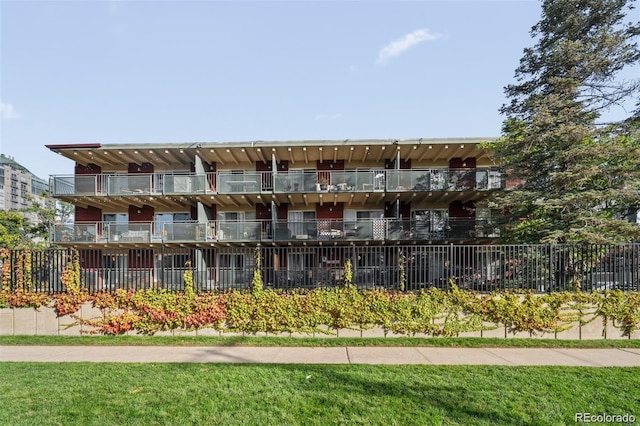 view of building exterior with fence