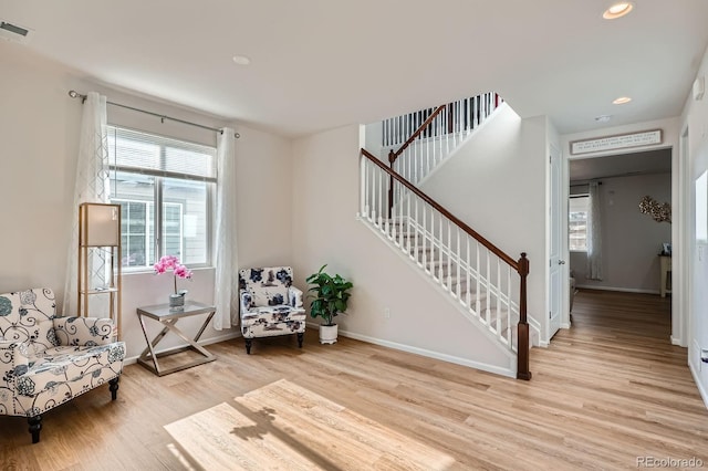 21837 E Stanford Cir, Aurora, CO 80015 - living area featuring light wood-style floors, stairs, and recessed lighting