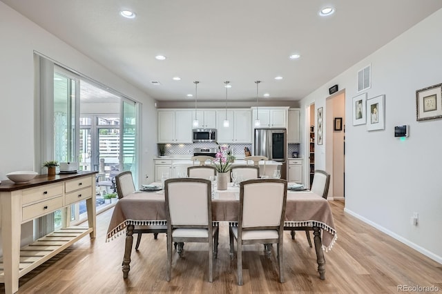 21837 E Stanford Cir, Aurora, CO 80015 - dining area featuring light wood finished floors and recessed lighting