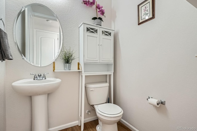 21837 E Stanford Cir, Aurora, CO 80015 - half bathroom with wood finished floors and toilet