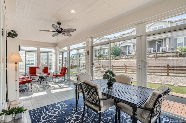 21837 E Stanford Cir, Aurora, CO 80015 - sunroom with ceiling fan and outdoor dining space