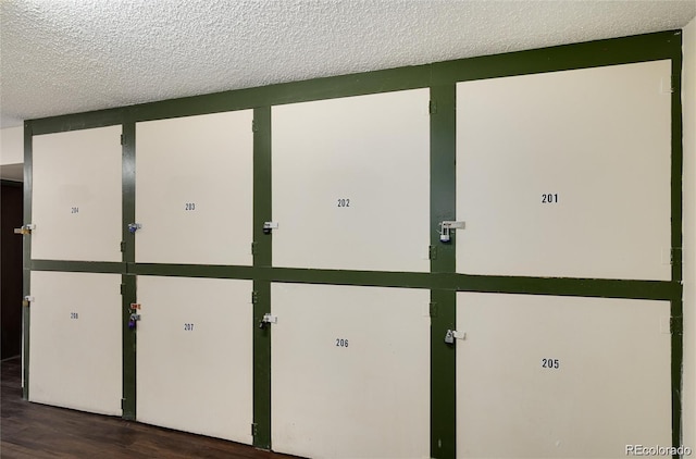 details with hardwood / wood-style floors and a textured ceiling