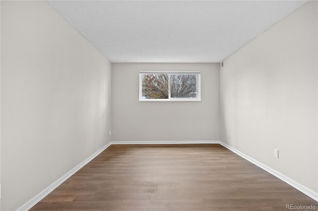 unfurnished room featuring wood-type flooring