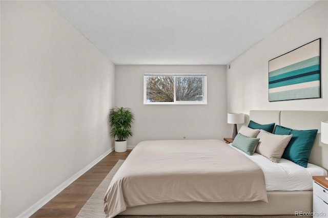 bedroom featuring dark wood-type flooring