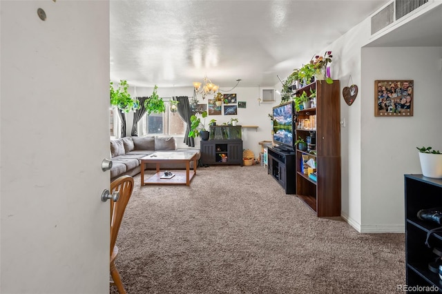 3613 S Sheridan Blvd Unit 10, Denver, CO 80235 - carpeted living room featuring a chandelier