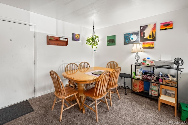 3613 S Sheridan Blvd Unit 10, Denver, CO 80235 - dining space featuring carpet and baseboards