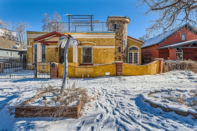 snow covered house with a balcony