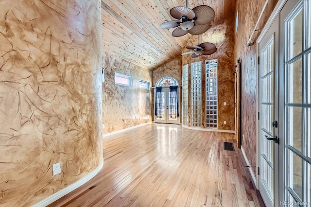 unfurnished room with ceiling fan, french doors, wooden ceiling, high vaulted ceiling, and hardwood / wood-style flooring