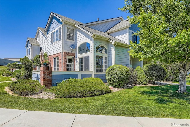 9653 Deerhorn Ct Unit 143, Parker, CO 80134 - view of property exterior with a yard and brick siding