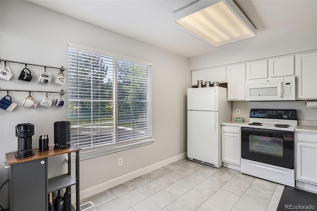 9653 Deerhorn Ct Unit 143, Parker, CO 80134 - kitchen featuring white appliances, light countertops, and white cabinets