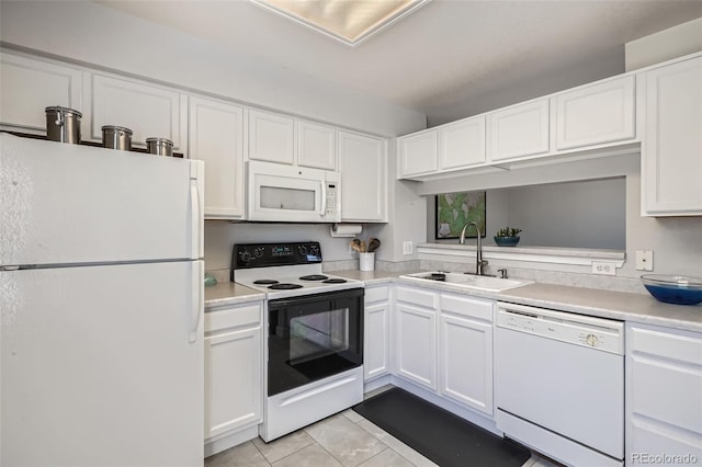 9653 Deerhorn Ct Unit 143, Parker, CO 80134 - kitchen with white appliances, white cabinets, light tile patterned flooring, and light countertops