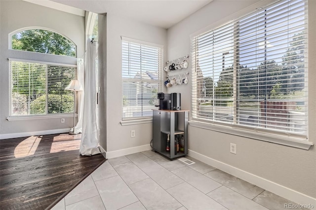 9653 Deerhorn Ct Unit 143, Parker, CO 80134 - empty room with plenty of natural light and light tile patterned floors