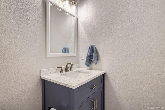 9653 Deerhorn Ct Unit 143, Parker, CO 80134 - bathroom with a textured wall and vanity
