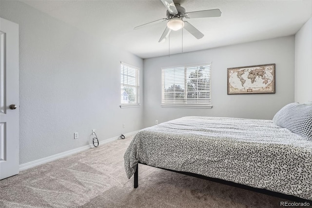 9653 Deerhorn Ct Unit 143, Parker, CO 80134 - carpeted bedroom featuring baseboards and ceiling fan