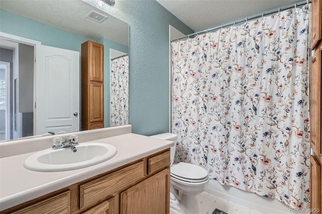 9653 Deerhorn Ct Unit 143, Parker, CO 80134 - bathroom featuring vanity, a textured wall, a textured ceiling, and tile patterned flooring