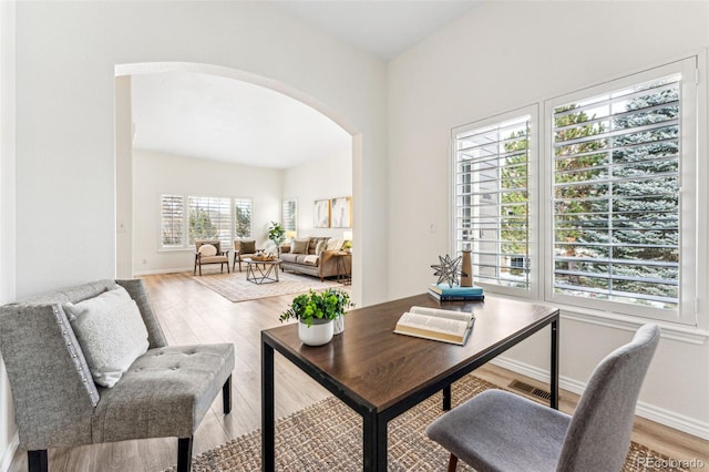 home office with hardwood / wood-style flooring