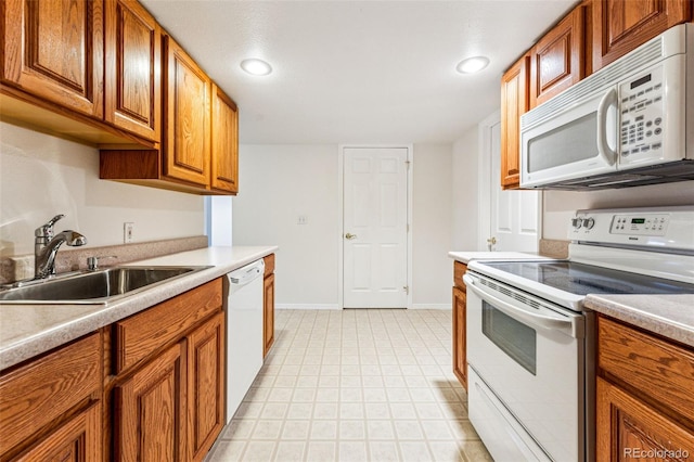 kitchen with sink and white appliances