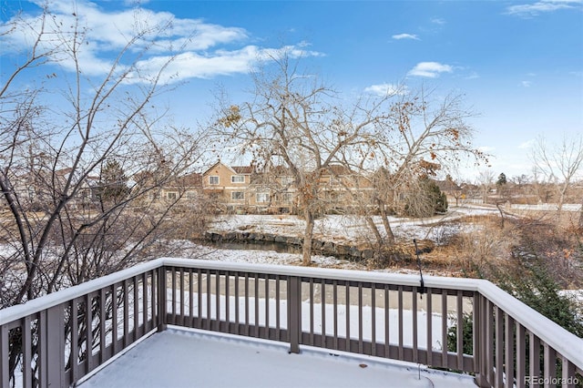 view of snow covered deck