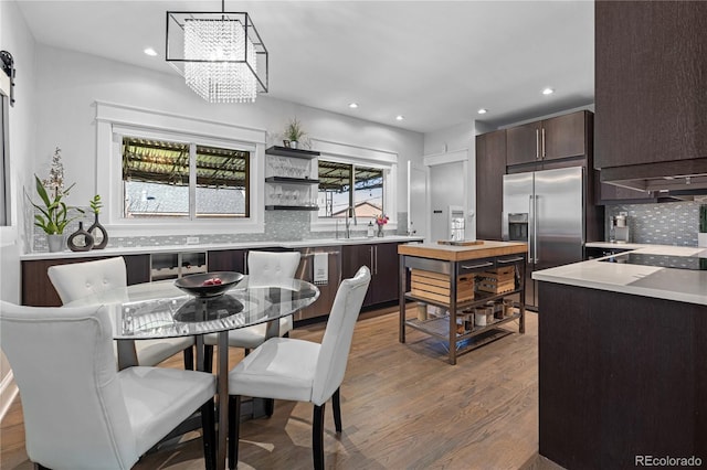 dining area featuring hardwood / wood-style floors and a chandelier