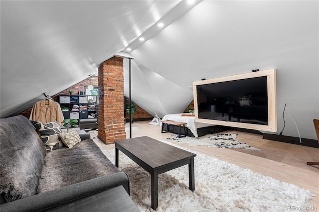 living room with lofted ceiling and light wood-type flooring