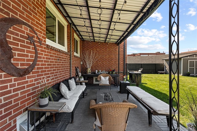 view of patio / terrace featuring a storage shed and an outdoor hangout area