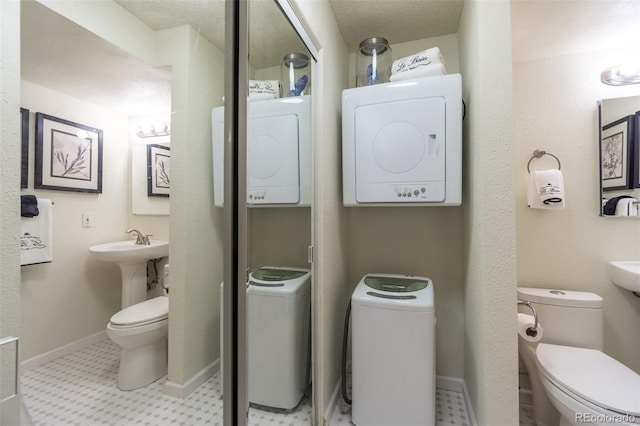 half bath featuring toilet and tile patterned floors